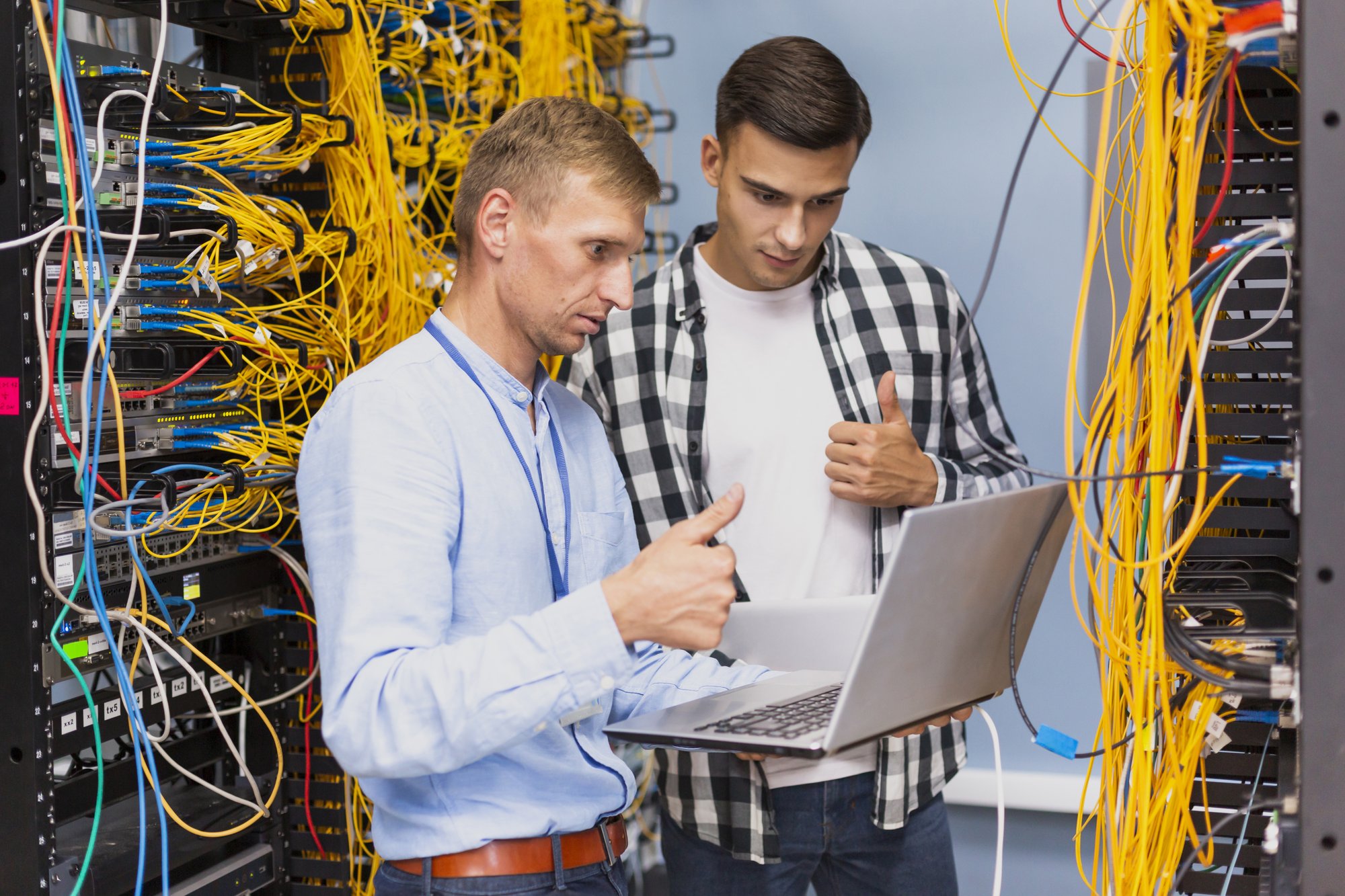 young-network-engineers-with-laptop-medium-shot